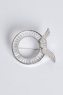 text -- silver brooch
