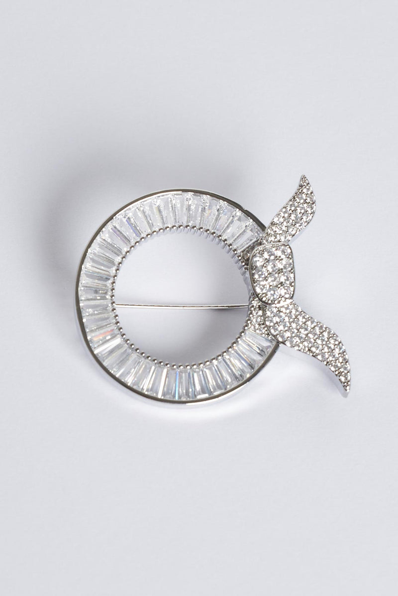 text -- silver brooch