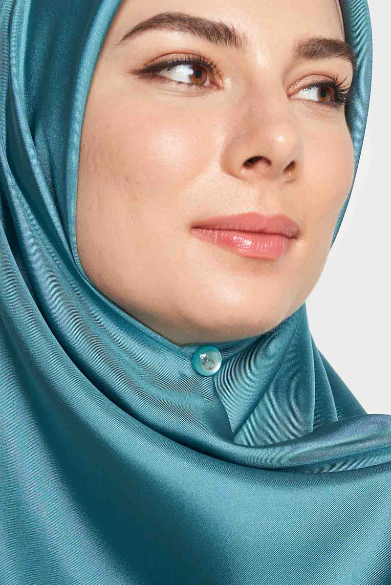 text -- shimmering teal