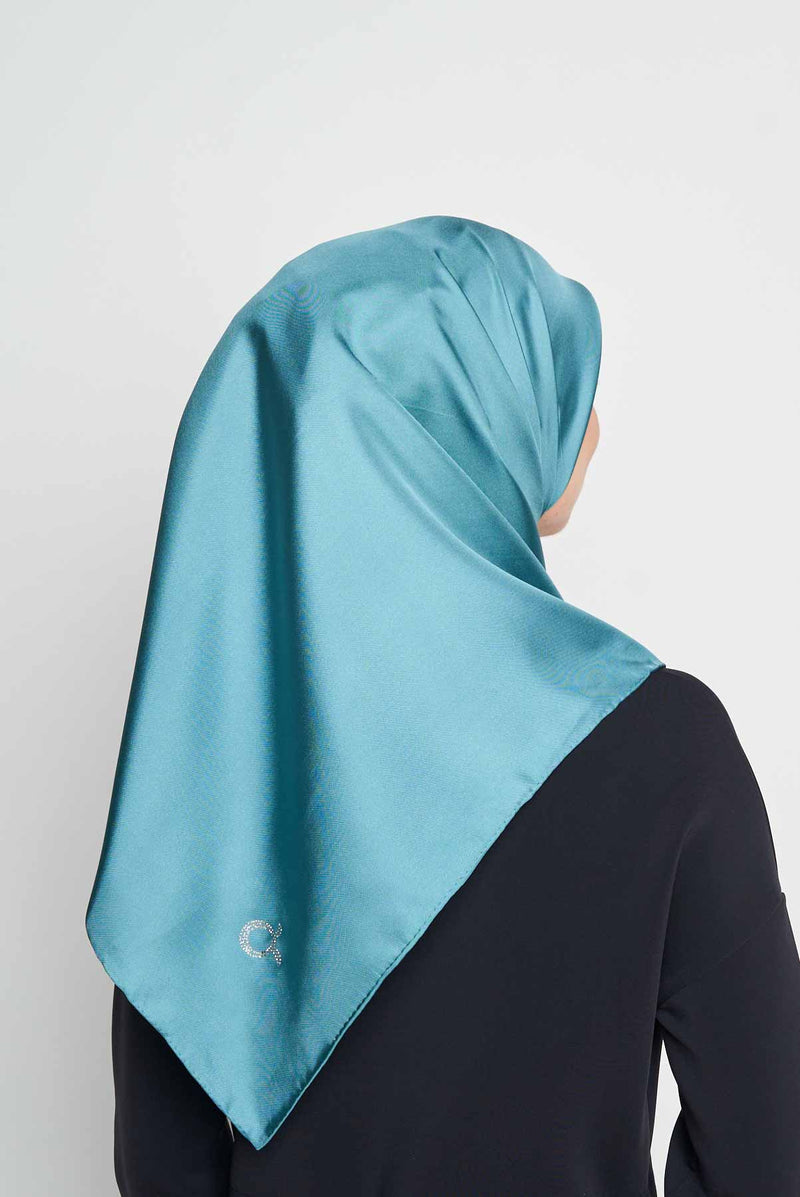 text -- shimmering teal