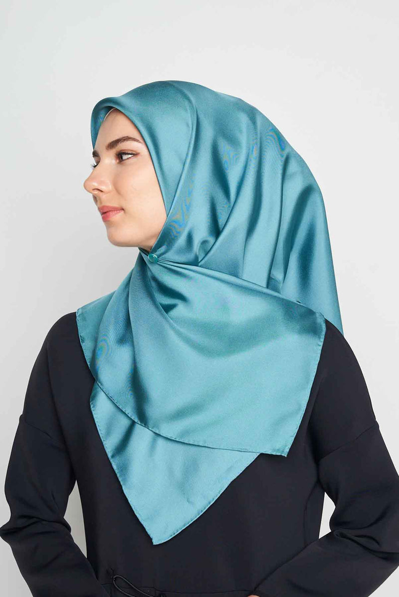 text -- shimmering teal