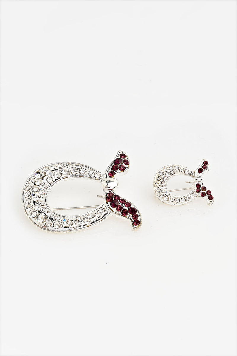 text -- brooch red